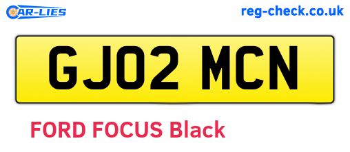 GJ02MCN are the vehicle registration plates.