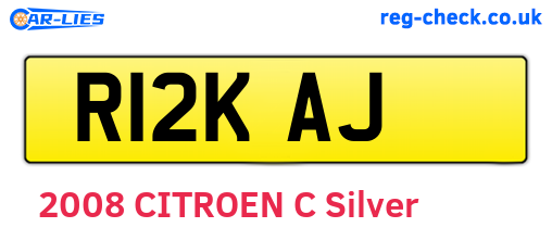 R12KAJ are the vehicle registration plates.