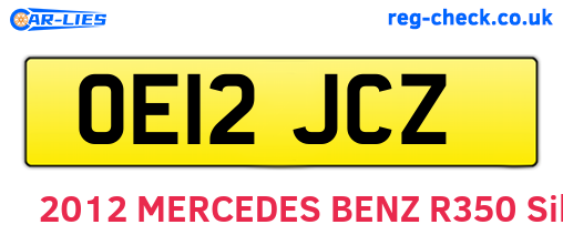 OE12JCZ are the vehicle registration plates.